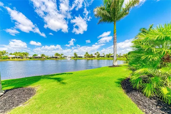 a view of a lake with a big yard