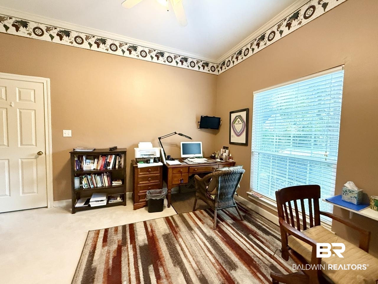 8091 Majors Court Daphne, AL 36526 - Photo 8 of 35 Home office with crown molding, carpet, a healthy amount of sunlight, and accordion doors