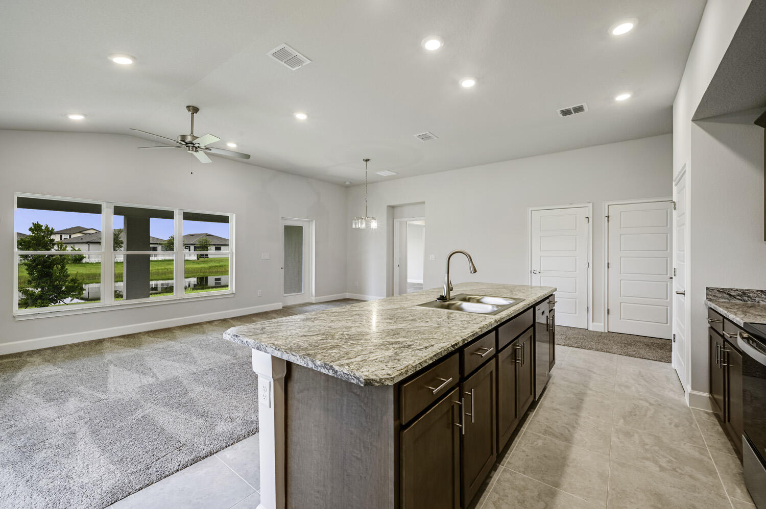 8623 Giovanni Avenue Fort Pierce, FL 34951 - Photo 13 of 28 a kitchen with a stove and a sink