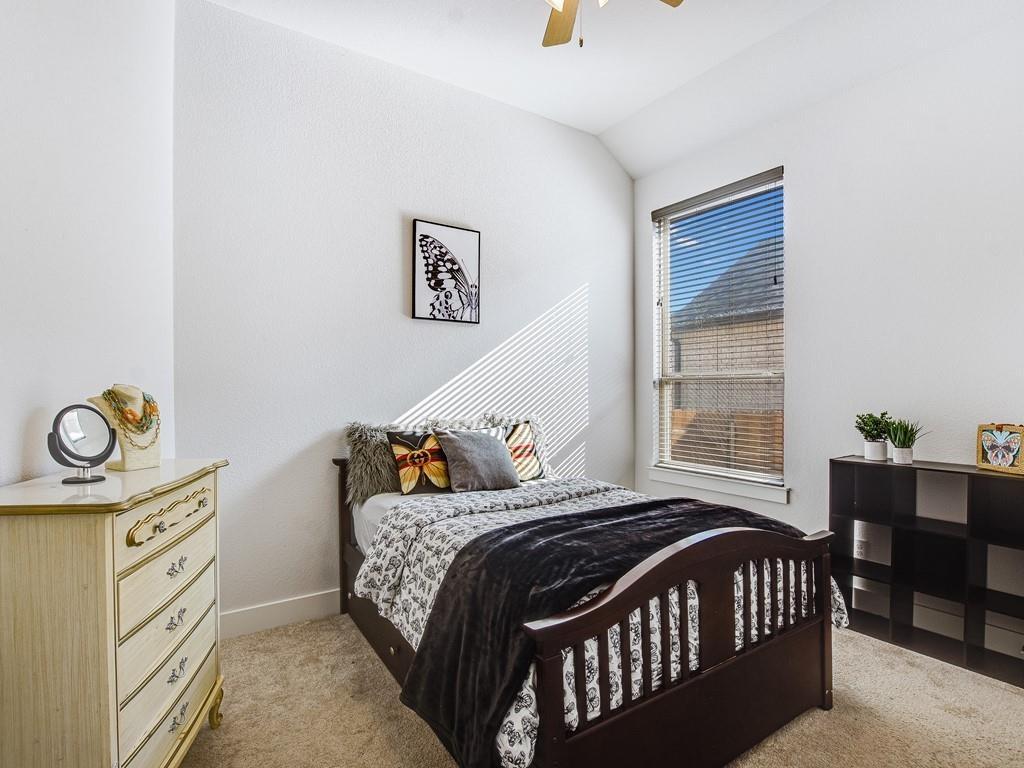 8409 Prairie Rye Drive Lago Vista, TX 78645 - Photo 12 of 17 a bedroom with a bed and window
