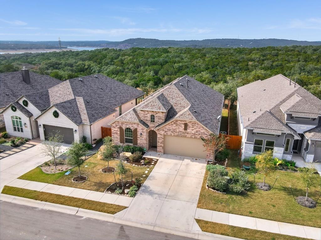 8409 Prairie Rye Drive Lago Vista, TX 78645 - Photo 2 of 17 an aerial view of a house with a garden