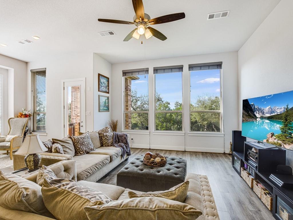 8409 Prairie Rye Drive Lago Vista, TX 78645 - Photo 5 of 17 a living room with furniture and a flat screen tv