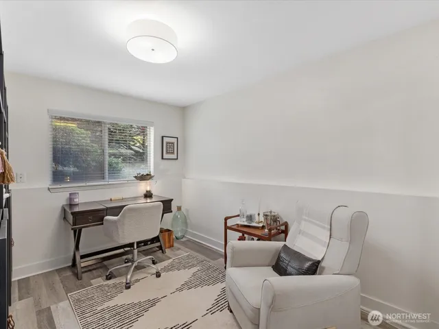 a living room with furniture a window and a table