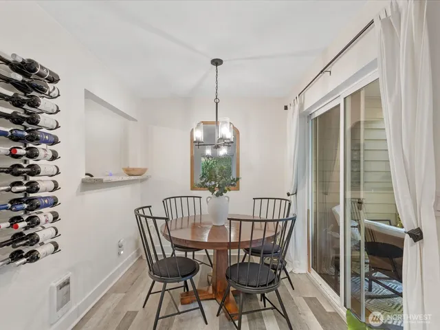 a view of a dining room with furniture window and wooden floor