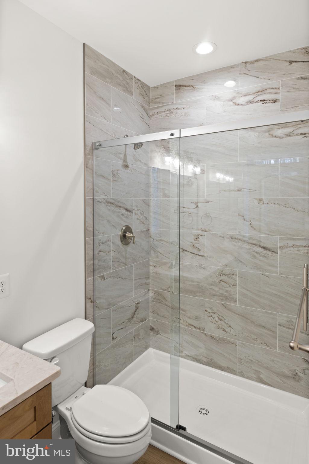 27 Colony Way Montross, VA 22520 - Photo 25 of 90 a bathroom with a shower a toilet and sink