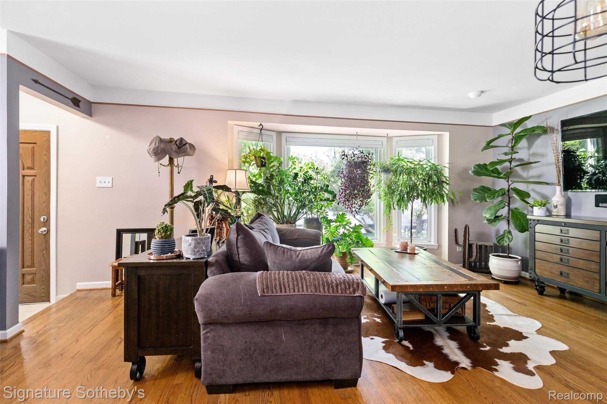 Bay window floods the living room with natural light