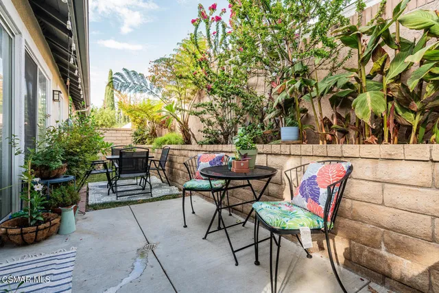 a view of backyard with sitting area