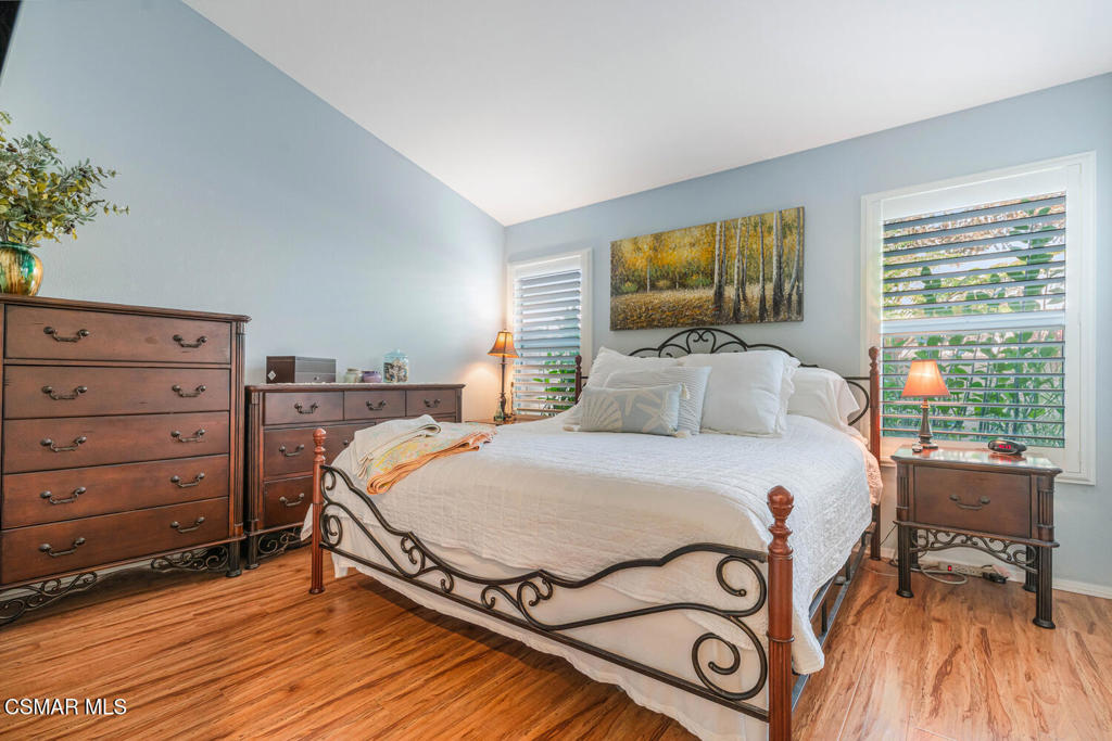 2040 Freesia Avenue Simi Valley, CA 93063 - Photo 16 of 26 a bedroom with a bed and large windows