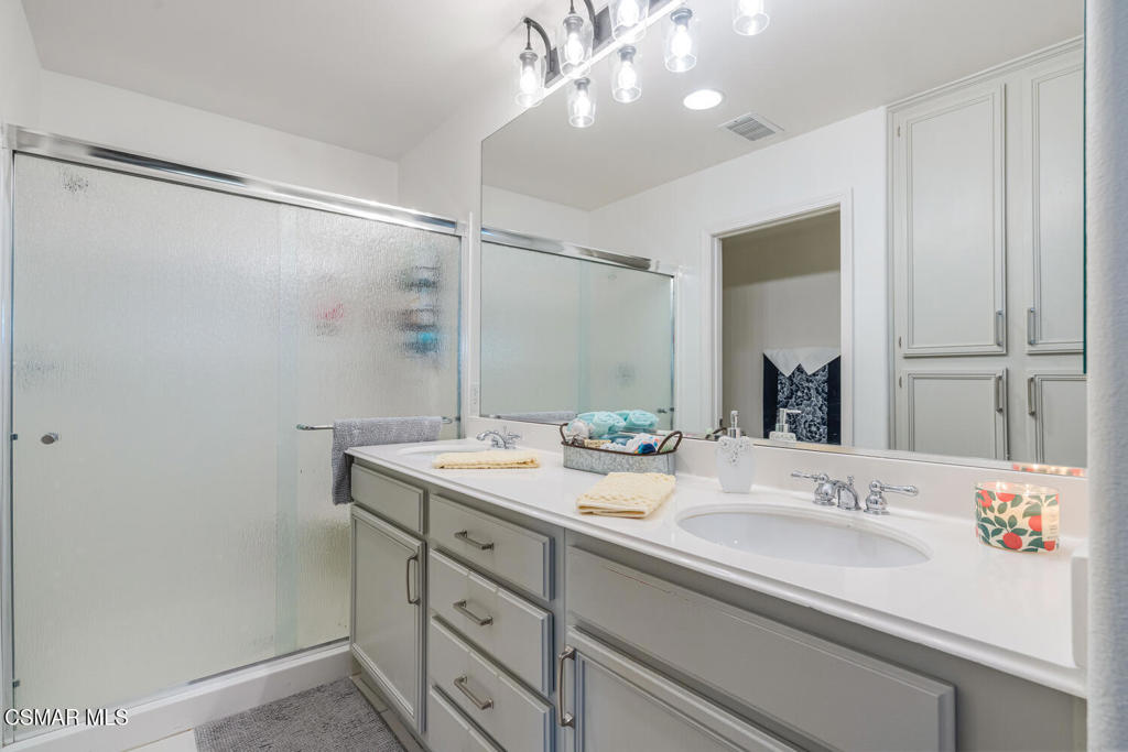 2040 Freesia Avenue Simi Valley, CA 93063 - Photo 18 of 26 a bathroom with a sink double vanity and a mirror