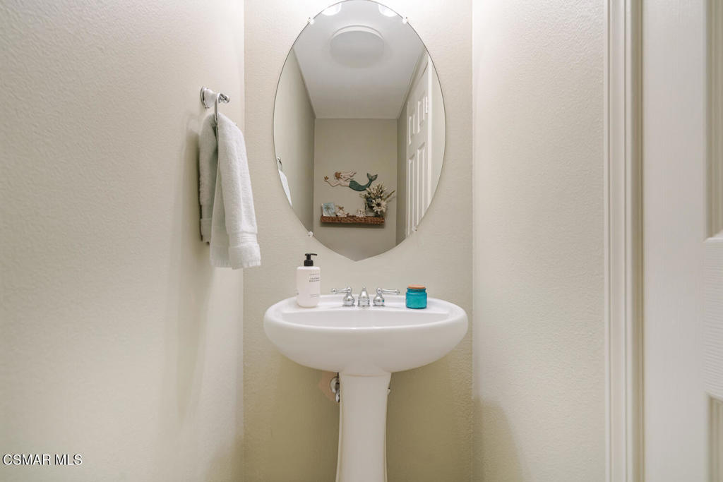 2040 Freesia Avenue Simi Valley, CA 93063 - Photo 19 of 26 a bathroom with a sink and a mirror