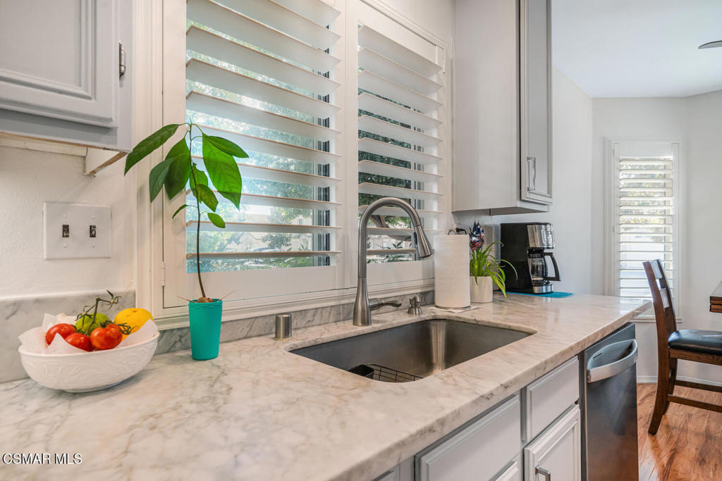 2040 Freesia Avenue Simi Valley, CA 93063 - Photo 6 of 26 a kitchen with a sink and a potted plant