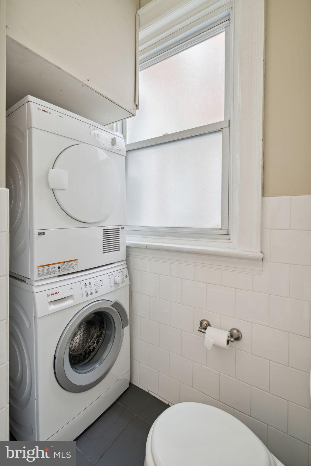 1955 Locust Street, Unit 2R Philadelphia, PA 19103 - Photo 14 of 19 a close view of a toilet and a washer dryer