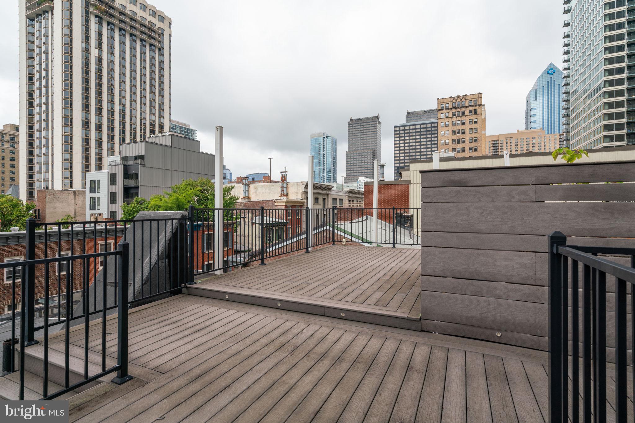 1955 Locust Street, Unit 2R Philadelphia, PA 19103 - Photo 15 of 19 a view of a balcony with wooden floor