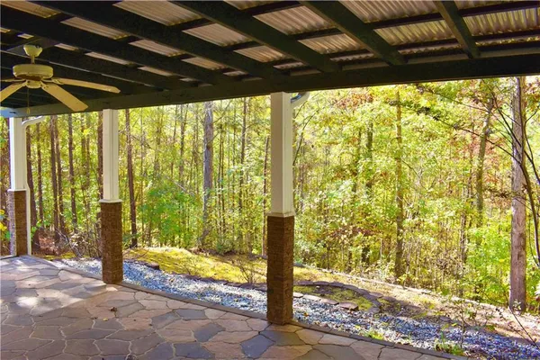 a view of porch with a bench and wooden floor