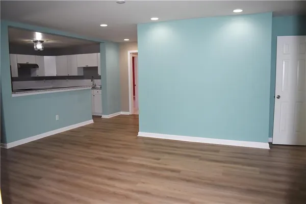 a view of kitchen with wooden floor