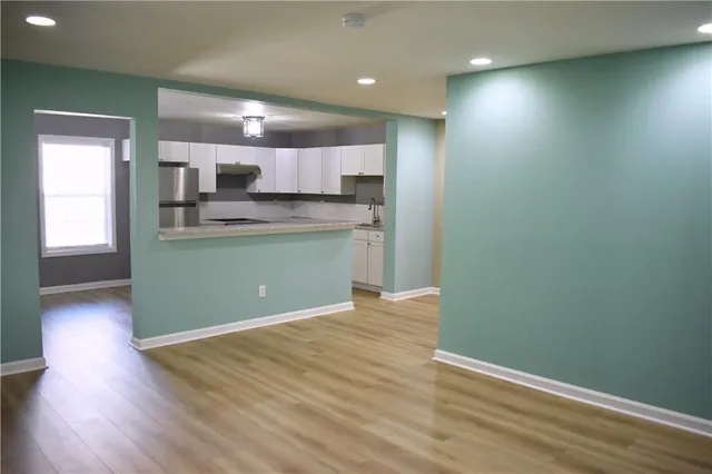 a view of kitchen with wooden floor
