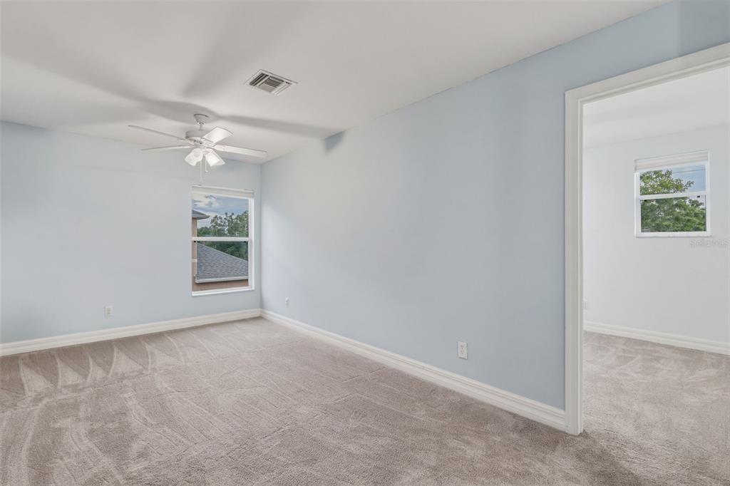 25134 Palisade Road Punta Gorda, FL 33983 - Photo 33 of 58 an empty room with windows and fan