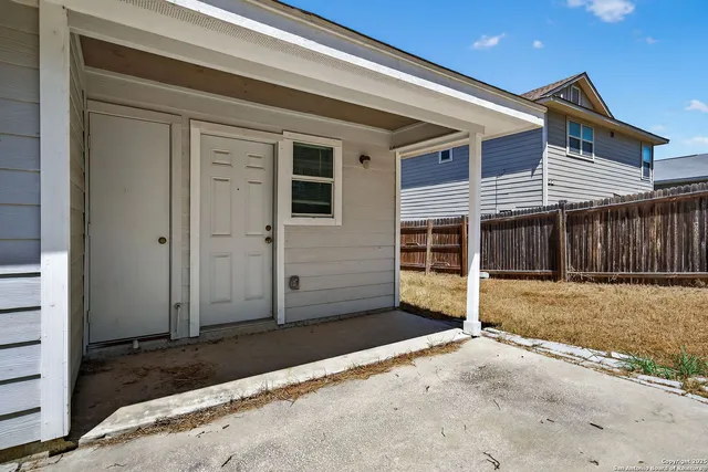 a view of a house with a yard and garage