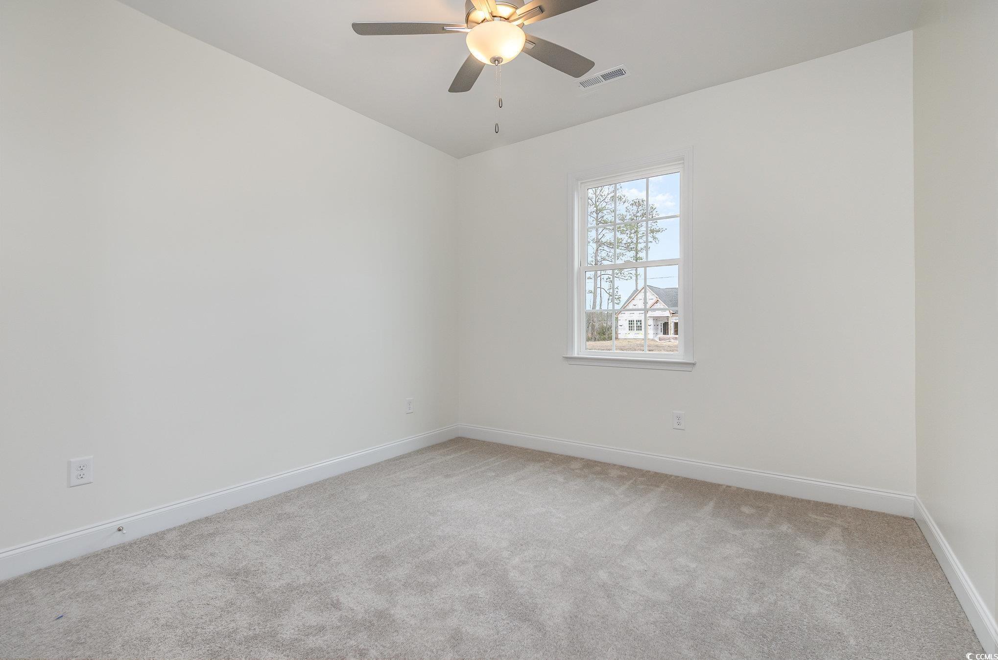 2104 Highway 9 Business Loris, SC 29569 - Photo 14 of 20 Spare room featuring light colored carpet and ceiling fan