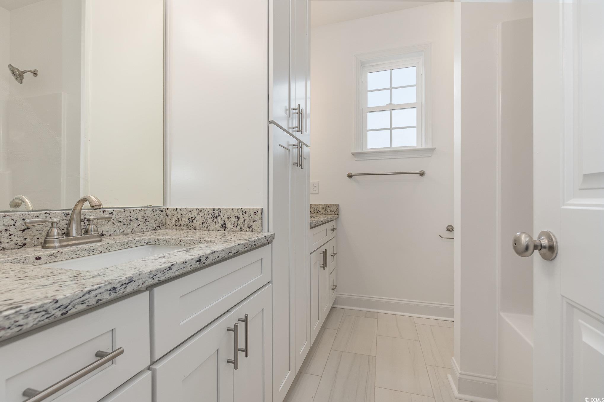 2104 Highway 9 Business Loris, SC 29569 - Photo 16 of 20 Full bathroom featuring two vanities and baseboards