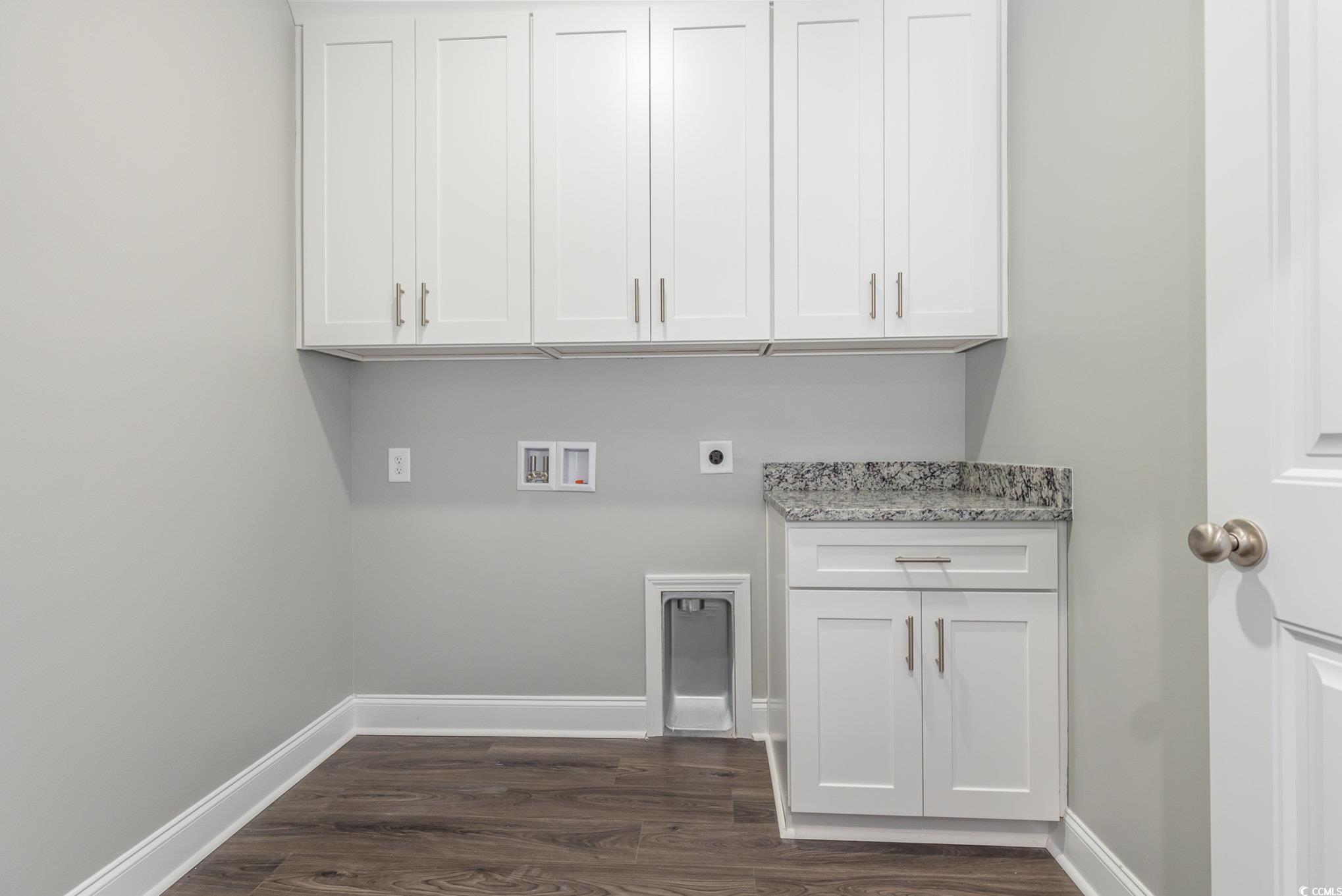 2104 Highway 9 Business Loris, SC 29569 - Photo 18 of 20 Laundry area with hookup for an electric dryer, dark wood-style floors, hookup for a washing machine, and cabinet space