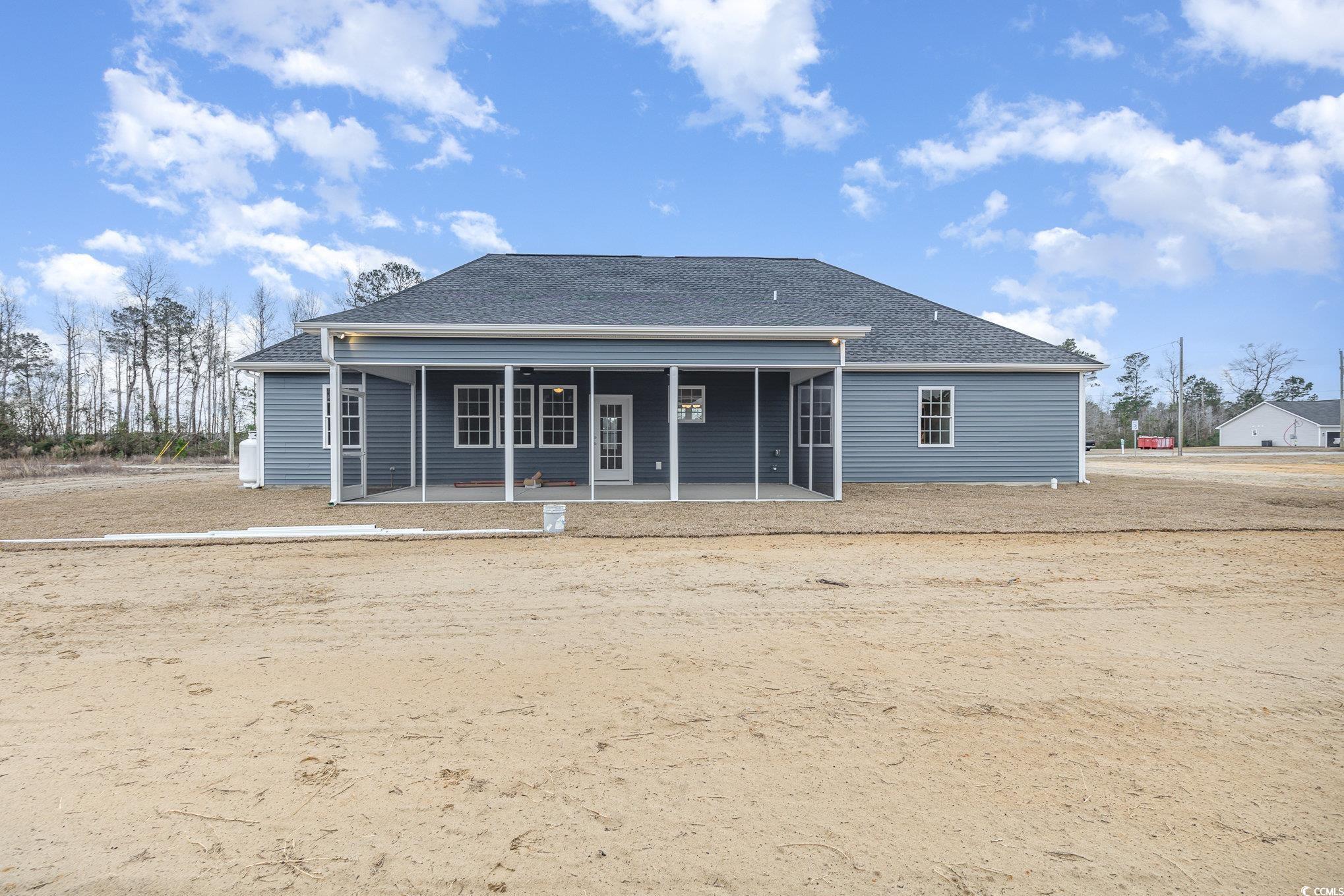 2104 Highway 9 Business Loris, SC 29569 - Photo 20 of 20 Rear view of house with roof with shingles and a patio