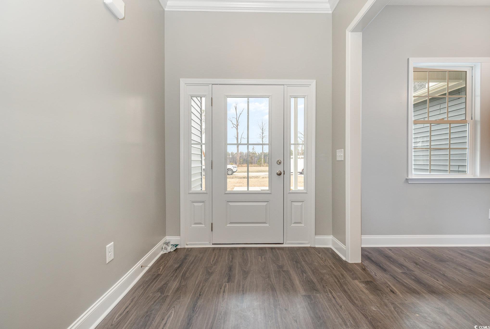 2104 Highway 9 Business Loris, SC 29569 - Photo 3 of 20 Entryway with dark wood-type flooring and ornamental molding