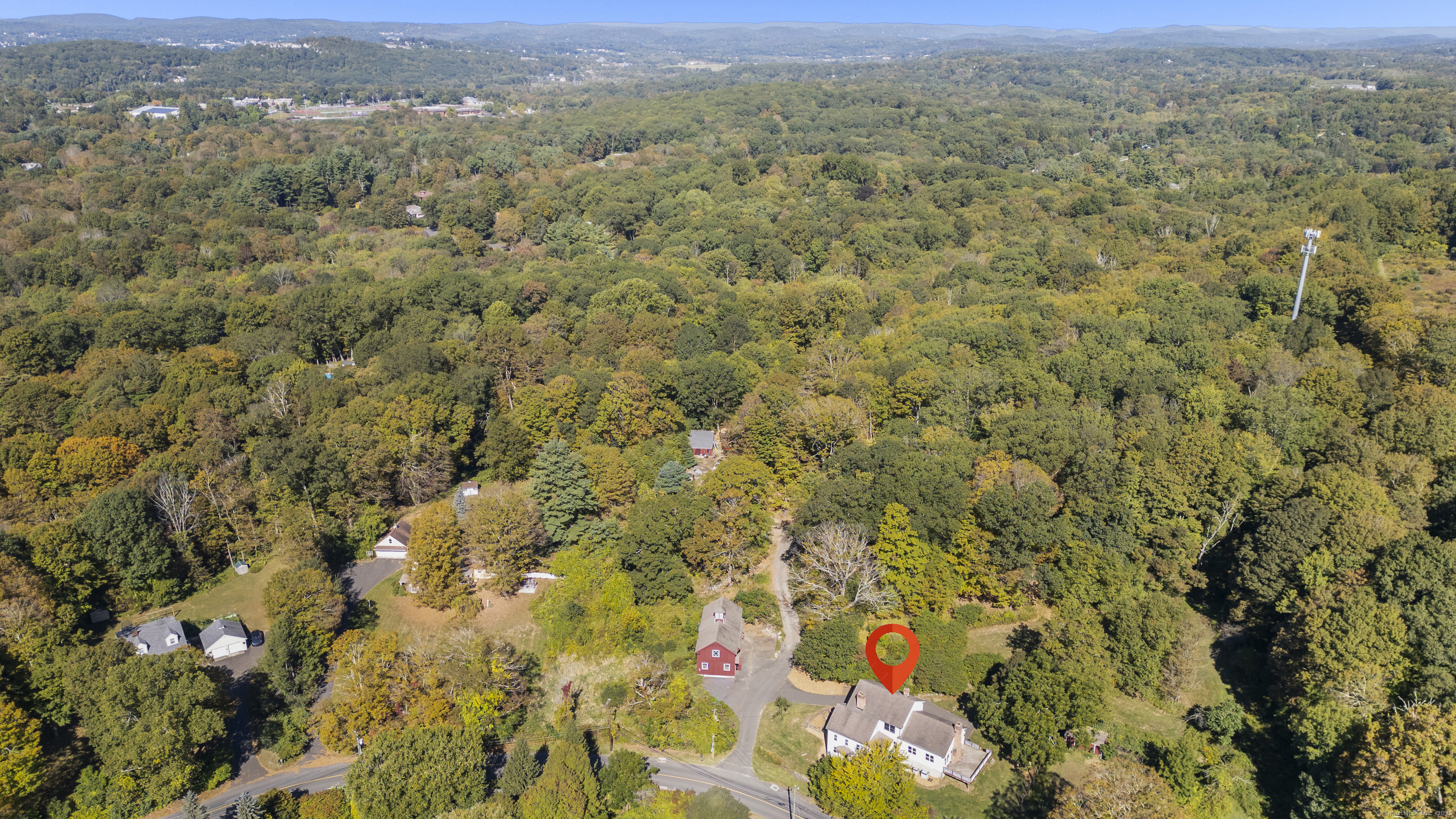 62 Codfish Hill Road Bethel, CT 06801 - Photo 20 of 25 a view of a city with lush green forest