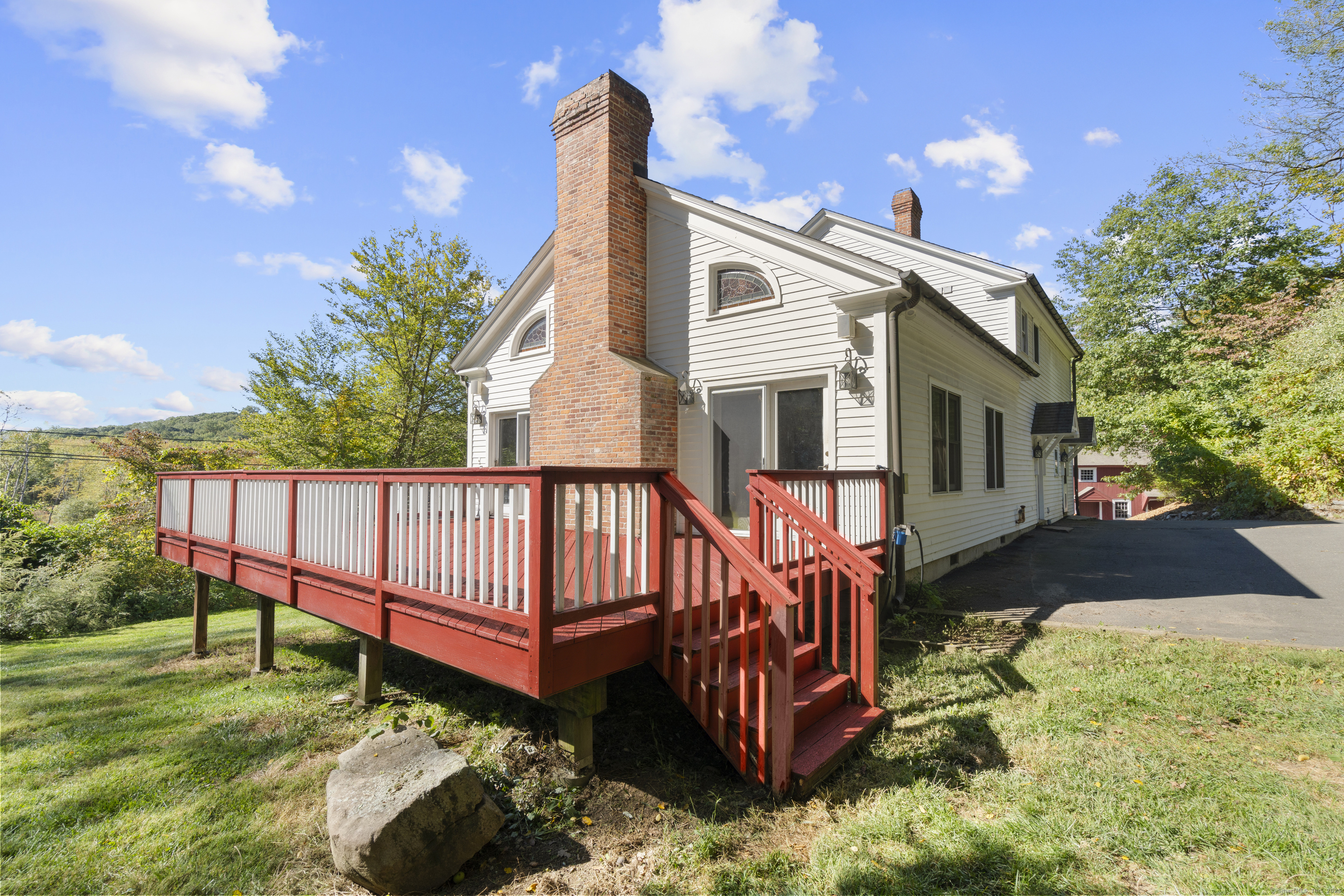 62 Codfish Hill Road Bethel, CT 06801 - Photo 8 of 25 a view of a house with wooden deck and a yard