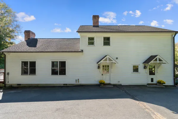 a front view of a house with parking space