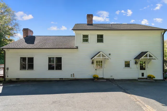 a front view of a house with parking space