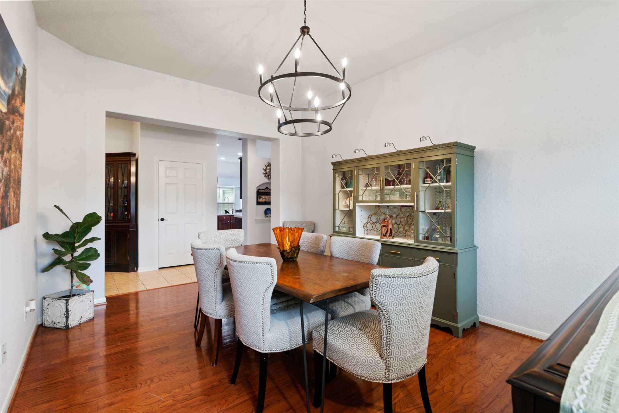 19306 Young Oak Street Spring, TX 77379 - Photo 6 of 28 The dining room features engineered wood floors and custom light fixture.