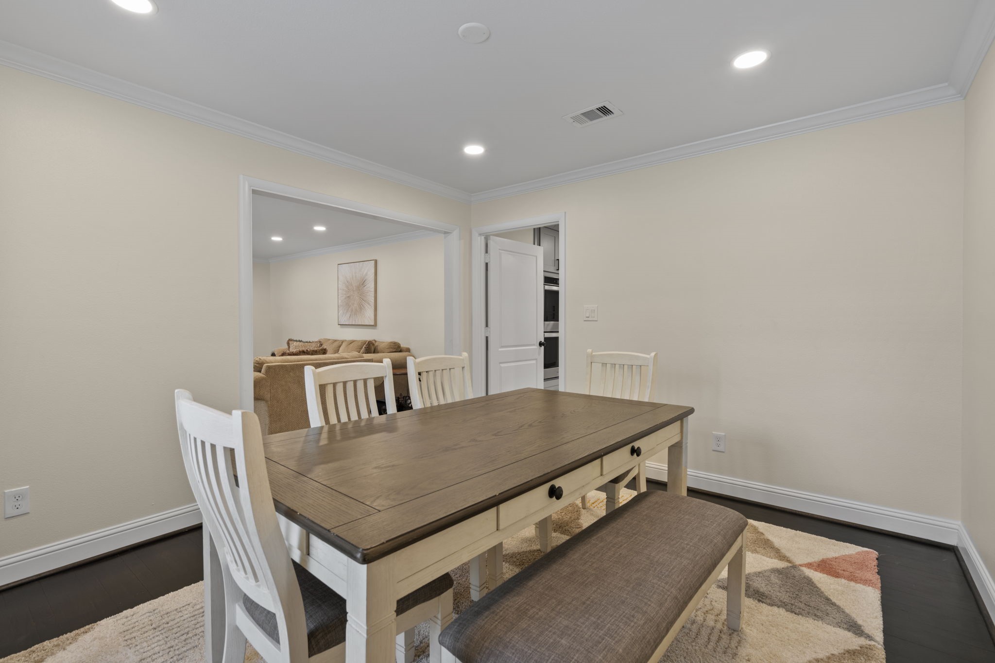 2402 Chimney Rock Road Houston, TX 77057 - Photo 12 of 36 The versatile living/dining area flows seamlessly into the family room. Modern style and effortless living!