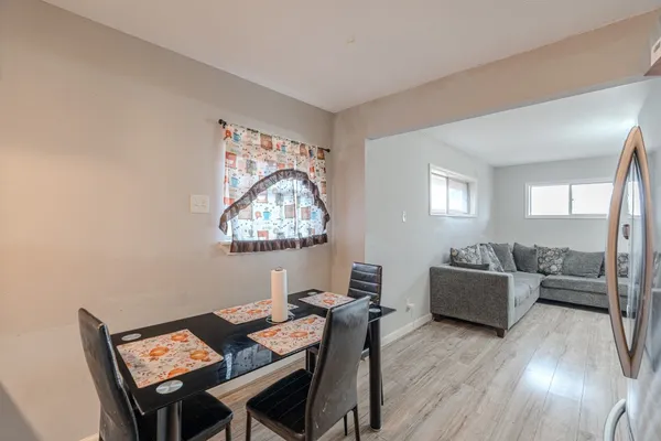 a view of a livingroom with furniture and a wooden floor