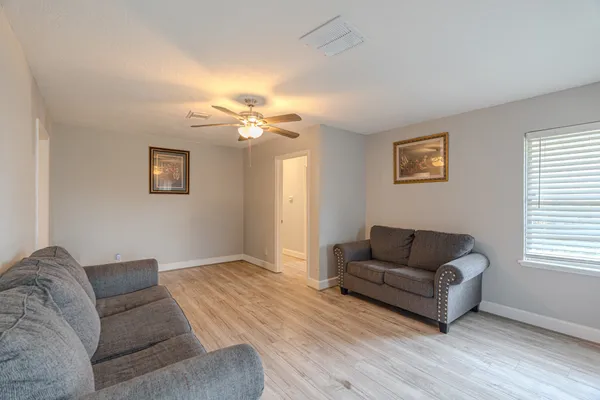 a living room with furniture and a window