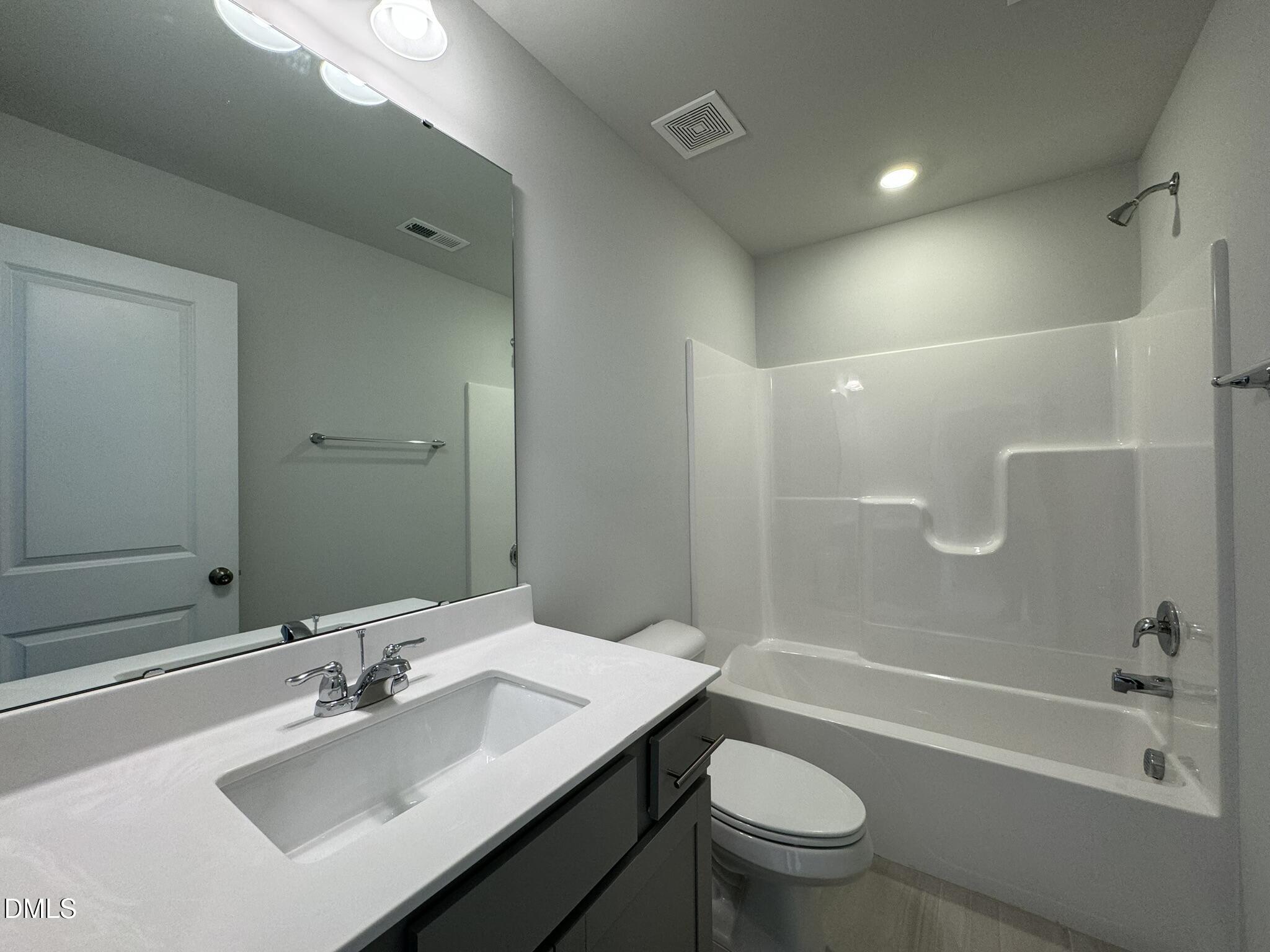 2509 Salt River Lane Raleigh, NC 27616 - Photo 30 of 34 a bathroom with a sink a toilet and shower