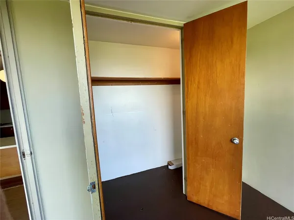 an empty room with wooden floor