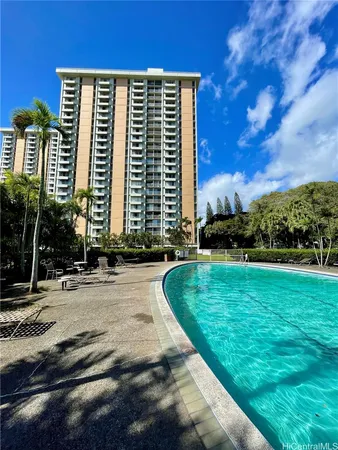 a front view of a residential apartment building with a yard
