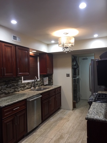 47 Red Barn Road Matteson, IL 60443 - Photo 4 of 8 a kitchen with a sink and a refrigerator