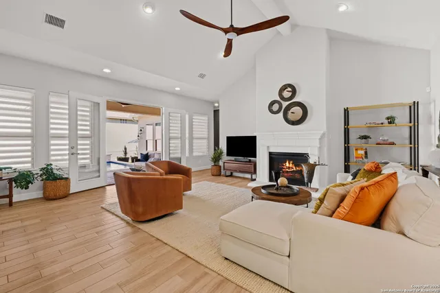 a living room with furniture and a fireplace
