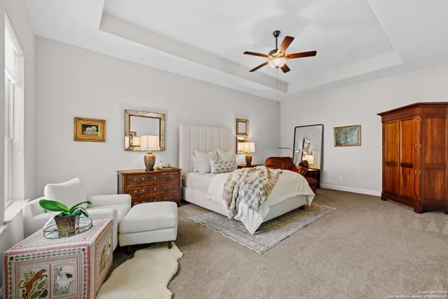 a bedroom with a bed couch and window