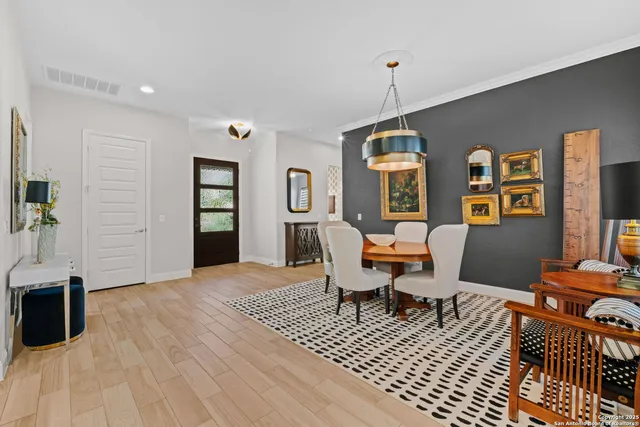 a living room with furniture a rug and a window