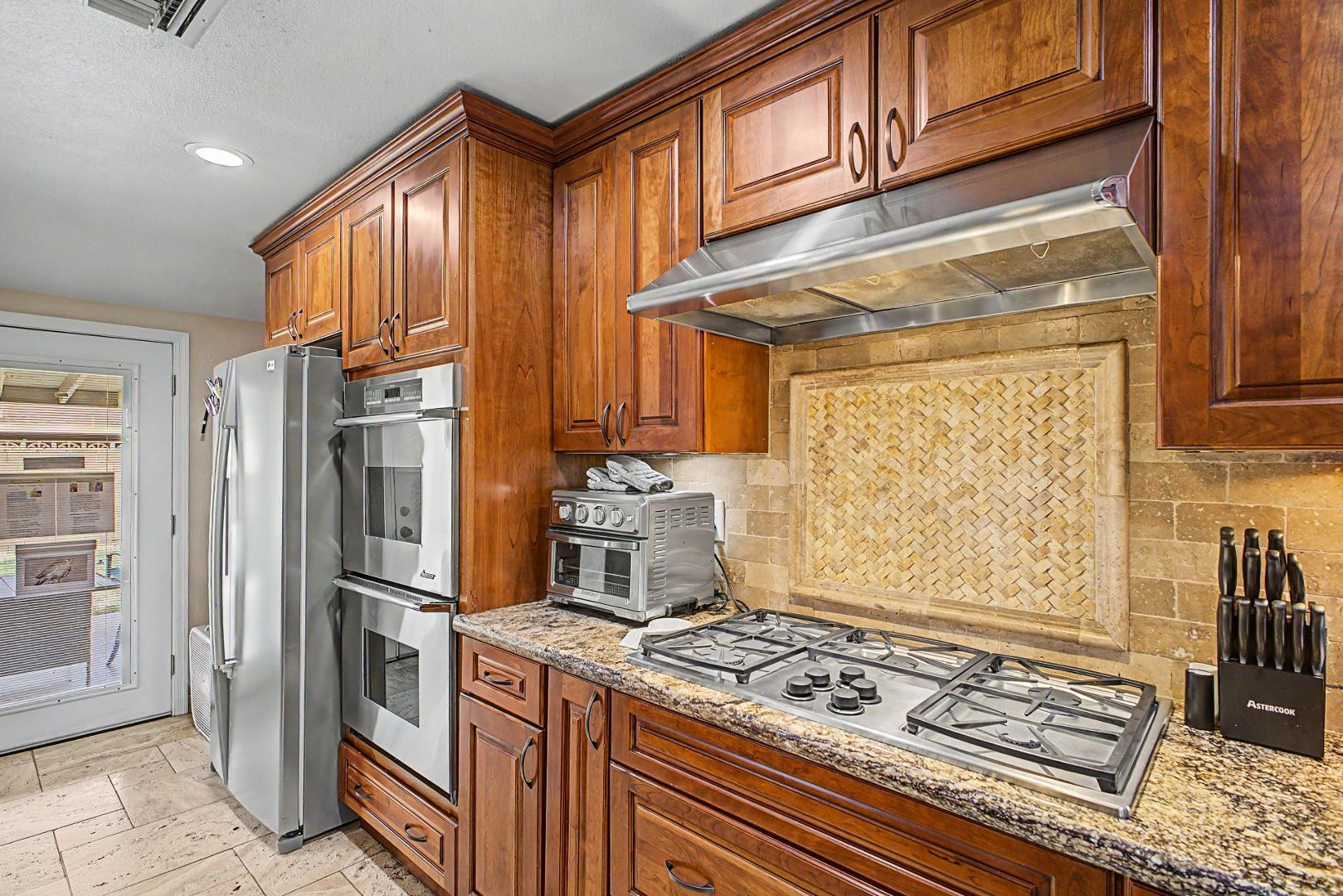 3346 East Cochise Road Phoenix, AZ 85028 - Photo 15 of 40 a kitchen with stainless steel appliances granite countertop a refrigerator and a stove