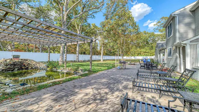 a view of a chair and tables in the patio
