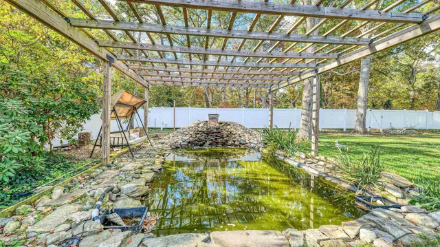 a view of yard with swimming pool