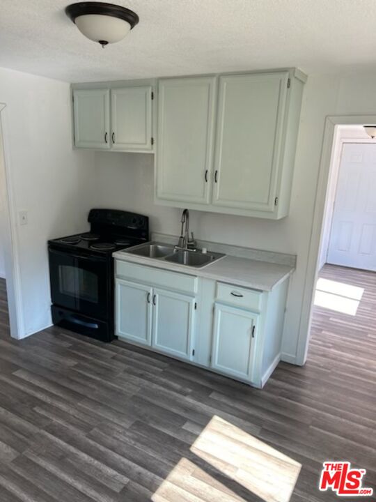 4132 Usona Road Mariposa, CA 95338 - Photo 25 of 26 a kitchen with stainless steel appliances granite countertop a sink stove and cabinets