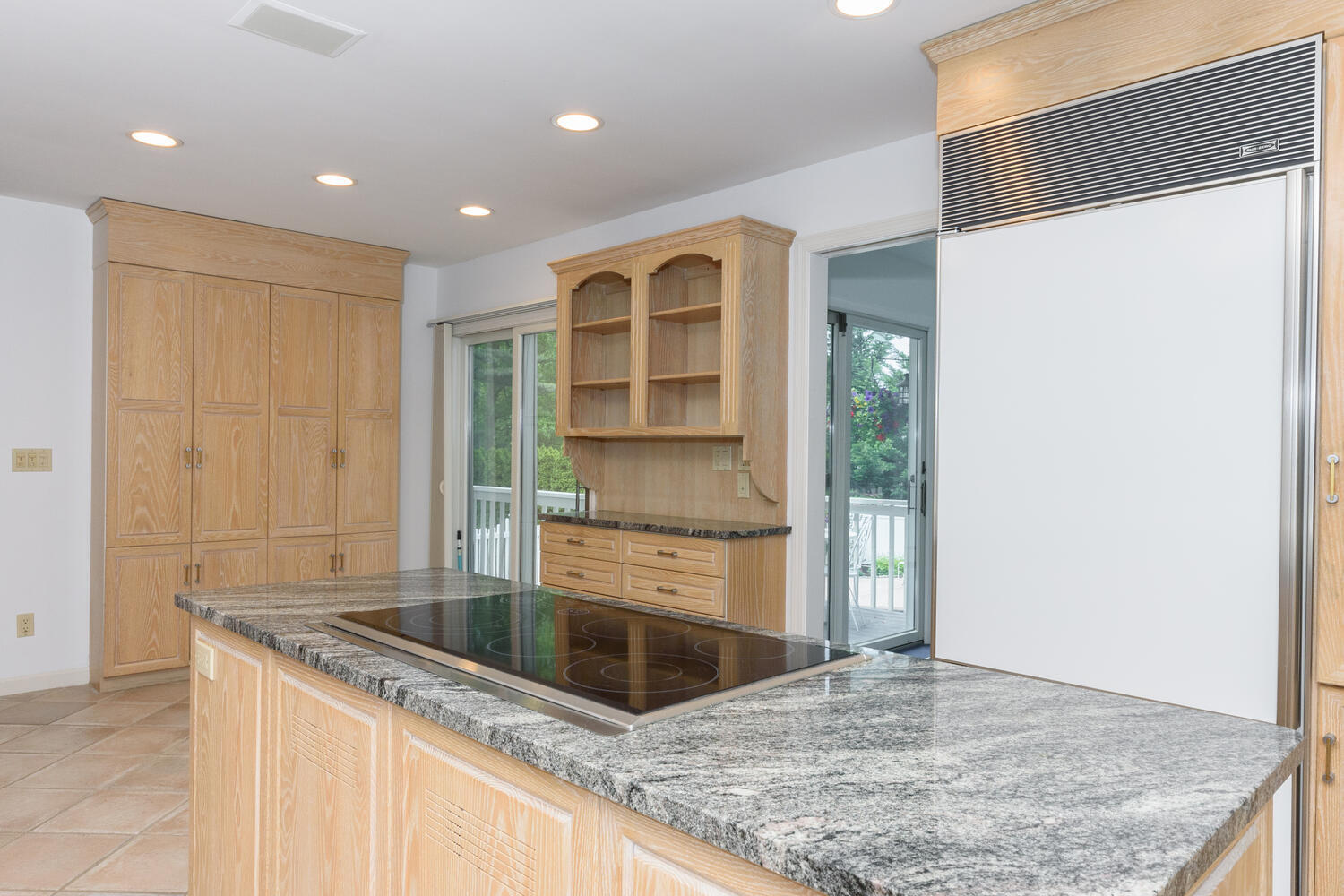32 Barringer Road Darien, CT 06820 - Photo 11 of 28 a kitchen with granite countertop a sink and a refrigerator