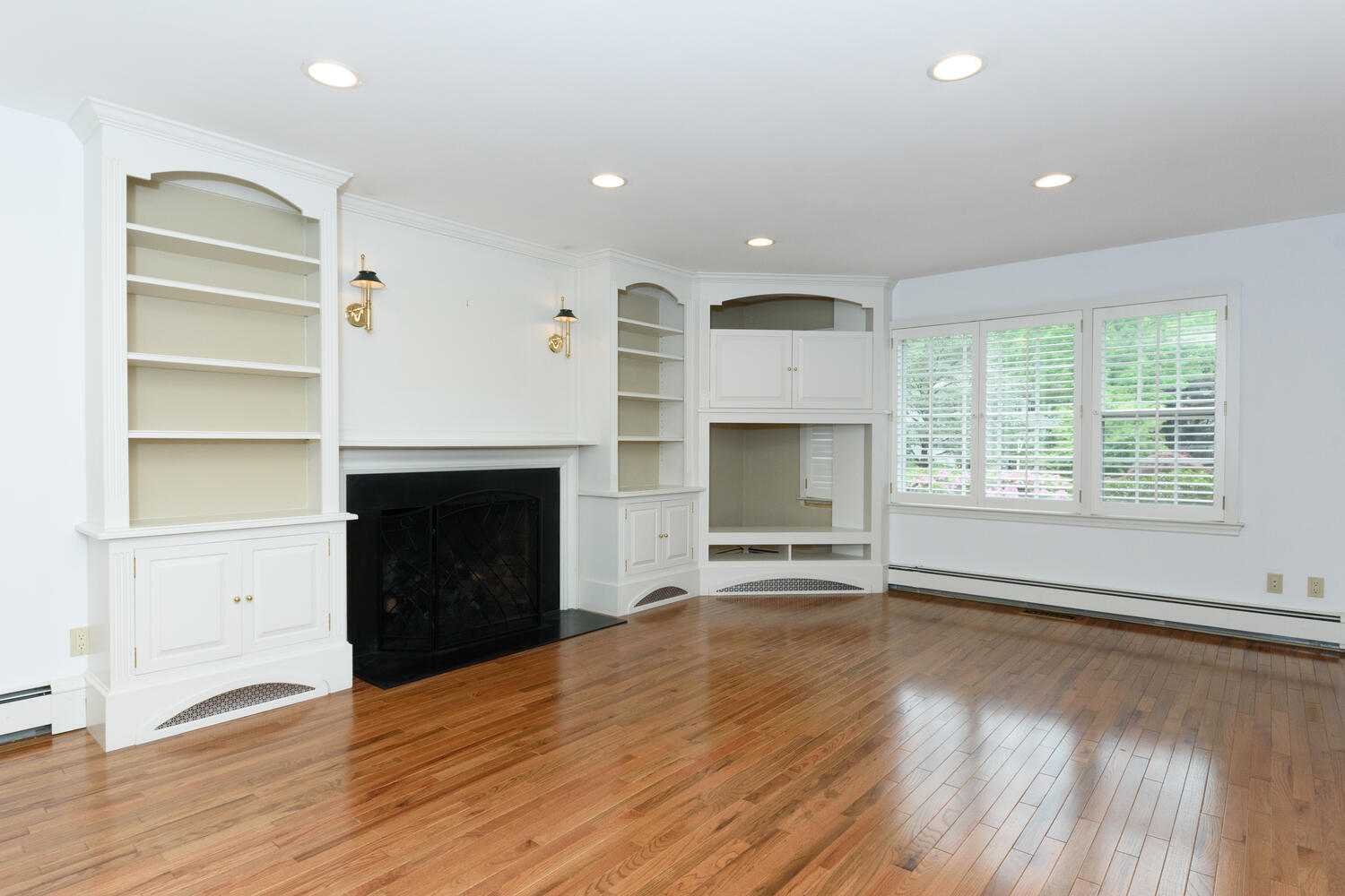 32 Barringer Road Darien, CT 06820 - Photo 12 of 28 an empty room with wooden floor fireplace and windows