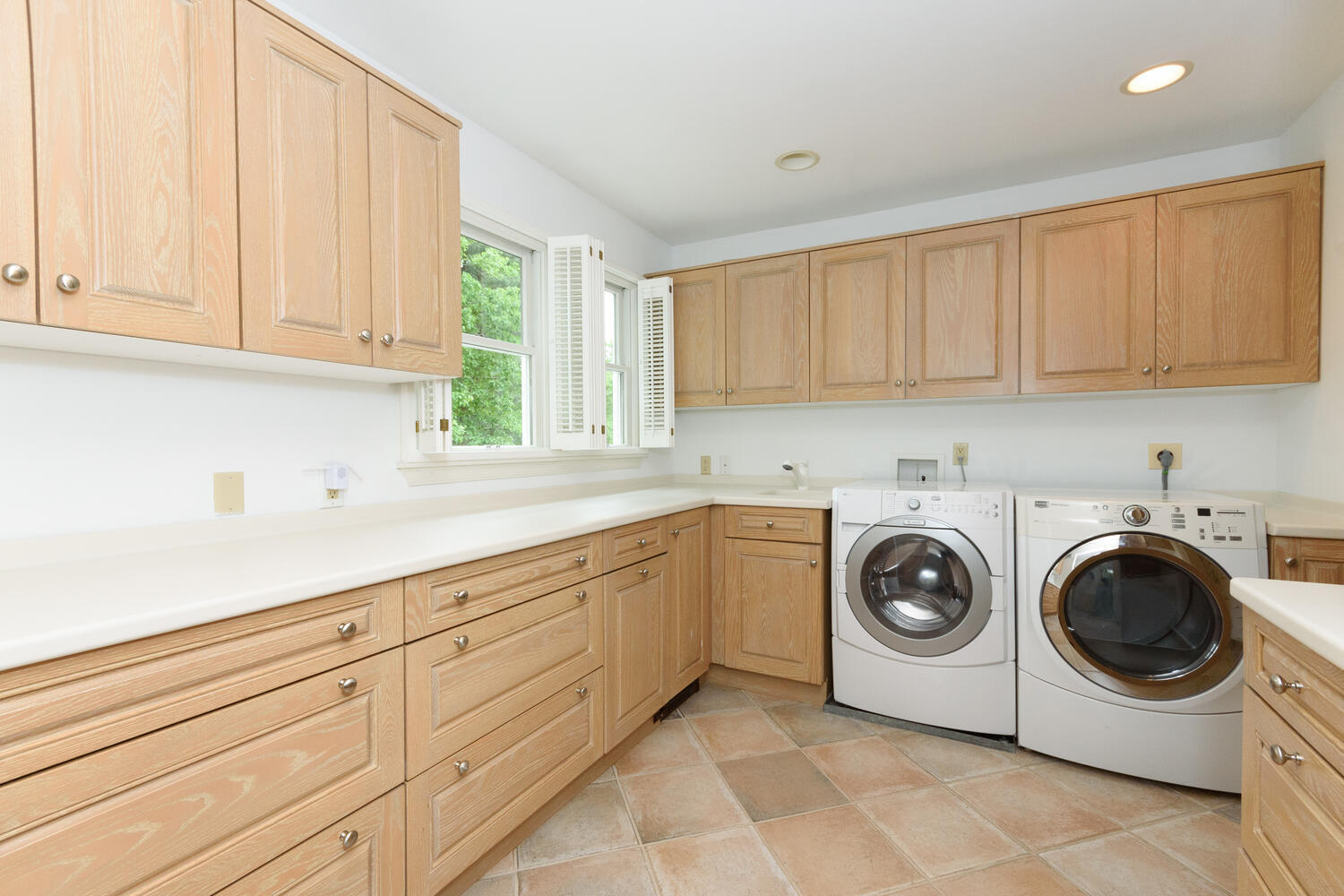 32 Barringer Road Darien, CT 06820 - Photo 15 of 28 a utility room with sink dryer and washer