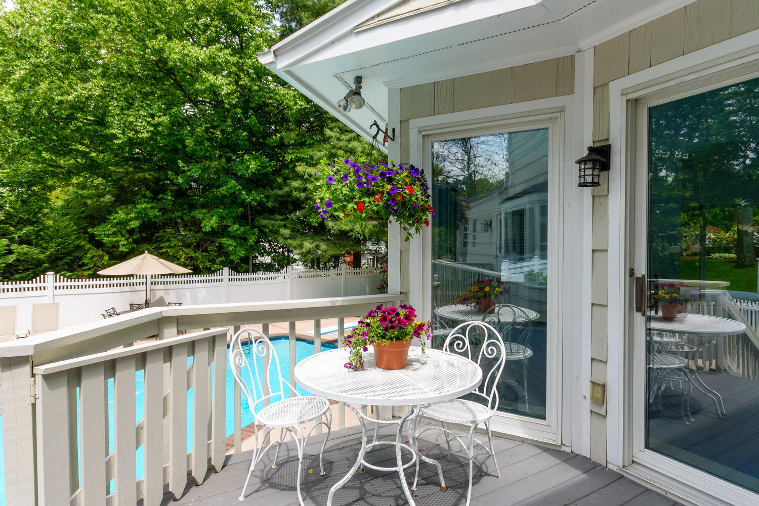 32 Barringer Road Darien, CT 06820 - Photo 23 of 28 a view of a patio with table and chairs and potted plants